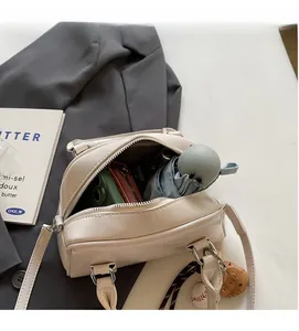 Interior view of cream white boston bag showing spacious storage for daily essentials