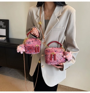 Detail of pink tweed texture and mini box bag craftsmanship with chain strap