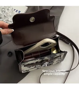 Interior view showing the storage capacity of the vintage printed shoulder bag