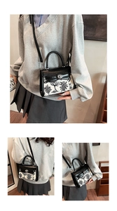 Detail of a chic black and white tree-patterned Kelly bag with a sleek metal clasp