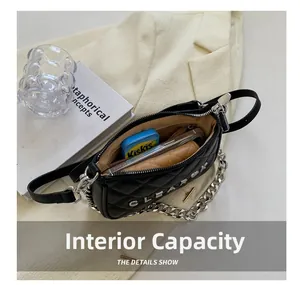 Detail view of black quilted leather bag interior showing spacious capacity for daily essentials
