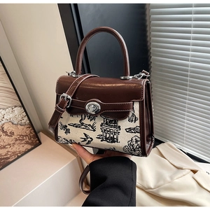 Detailed view of Kelly bag with mountain landscape print on canvas and leather trim