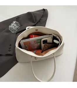 Top view of large capacity cream white tote bag showing spacious interior for daily items