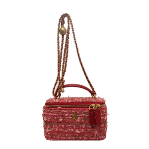 Mini borsa a scatola in tweed rosa e verde con manico in pelle rossa e chiusura a fiore