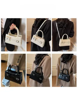Detailed views of crossbody bags in cream and black featuring elegant bow accents
