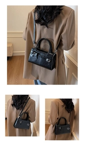 Detail view of the black crossbody bag with decorative buckle and strap from several angles
