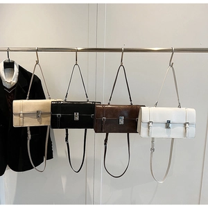 Detailed view of four retro envelope shoulder bags in apricot, black, coffee and white