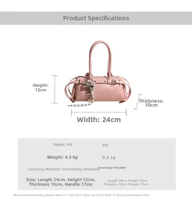 Detailed view of pink PU Boston bag with silver bow and heart charm plus dimensions