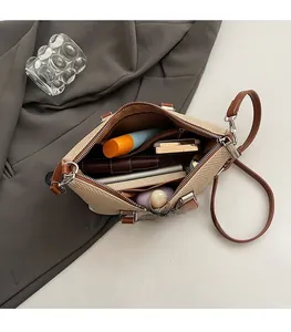 Top view of woven apricot bucket bag showing spacious interior with daily essentials