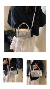 Detailed views of the silver mirror crossbody bag with top handle and metallic finish