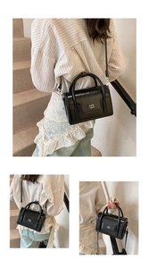 Detail of black glossy small square handbag featuring white COIN 2DN logo print