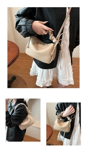 Detail of the elegant ruched handle and adjustable strap on the beige crossbody bag