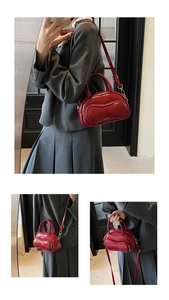 Close-up of deep red bowling bag showing glossy synthetic leather and layered design