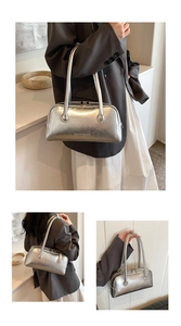 Detail of silver metallic Boston bag featuring pleated faux leather and SHIYUBAG logo