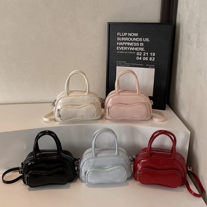 Women's trendy bowling-style crossbody bags in five solid colors with twin handles