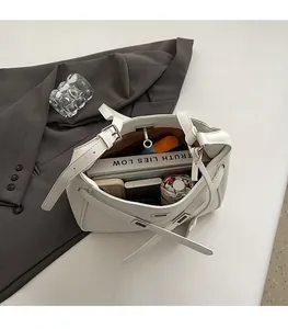 Practical internal view showing spacious capacity of the white tote bag with daily items