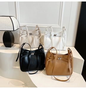 Minimalist tote bags in black, white, beige, and brown with silver buckles and ties