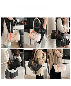 Dettagli della borsa tote da donna in nero e bianco crema con elegante catena in metallo