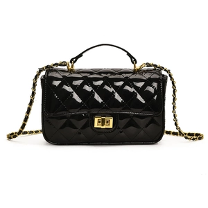 Glossy patent leather quilted small square handbag with golden chain strap and swivel lock