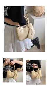Detail showing cream bucket bag with metal twist lock and small hanging coin pouch