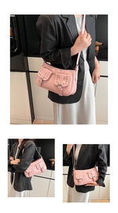 Detailed view of pink Y2K glossy faux leather underarm bag with silver rivets and pockets