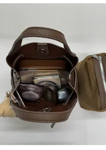 Top view of brown lychee leather bucket bag showing large interior space and inner pouch