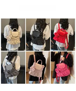 Detail view of nylon pleated backpacks in six colors with matching mini side pouches