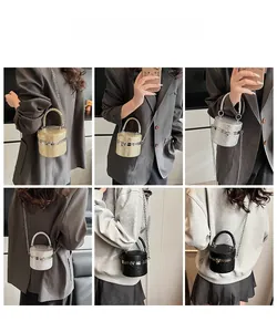 Multiple views of a quilted cylinder bucket bag with chain strap and woven handle