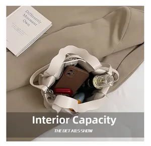 Top view showing the large interior capacity of this beige basket bag with daily items