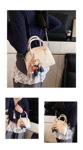 Korean minimalist lychee pattern handbag with cute bear pendant, stylish crossbody shell bag.