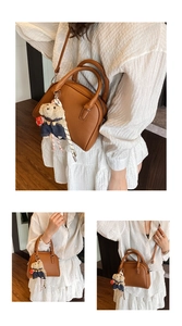 Korean style minimalist litchi texture top handle crossbody shell bag with cute bear pendant.