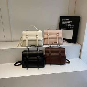 Retro vintage satchel bag collection in cream, pink, black and brown leather finishes