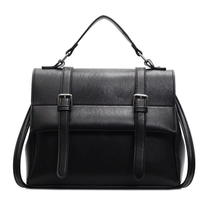 Classic black vintage messenger bag with top handle and silver buckles on white background