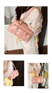 Detail view of the stylish pink patent leather shoulder bag, commuter underarm style.