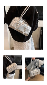 Silver metallic faux leather commuter shoulder bag with stylish front buckles and double straps.