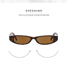 Detail view of vintage tortoise shell sunglasses with dark brown lenses and thick frames