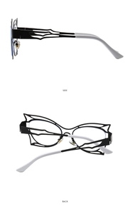 Detailsicht der Schmetterling-Cat-Eye-Brille mit schwarzem Metallrahmen und weißen Bügelenden