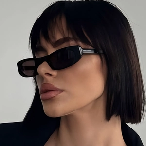 Fashionable black oval cat-eye sunglasses for women with a minimalist retro design