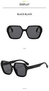 Detail view of black polygon sunglasses with textured checkered pattern on the temples