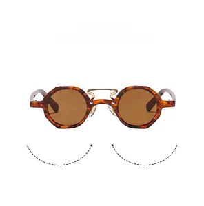 Close-up of retro tortoiseshell sunglasses with golden hollow metal bridge detail