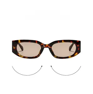 Detail of trendy retro narrow rectangular sunglasses with tortoiseshell frame and brown lenses