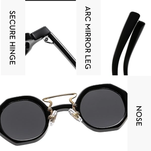 Close-up of secure metal hinge, arc mirror leg and soft nose pads on black sunglasses