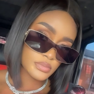 Fashionable oversized metal sunglasses and diamond necklace worn by a female model