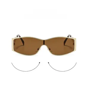 Detail view of gold metal frame and brown one-piece lenses on cycling sunglasses