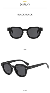 Makroansicht der schwarzen Polygon-Sonnenbrille mit Silbernieten von vorne und der Seite