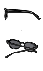 Detailsicht der polygonalen Sonnenbrille mit silbernen Nieten am schwarzen Rahmen
