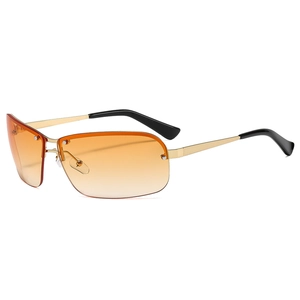 Y2K rimless sunglasses with gold metal frame and orange gradient lenses on white background