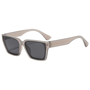 Minimalist square translucent grey sunglasses with dark grey lenses in a 45-degree angle