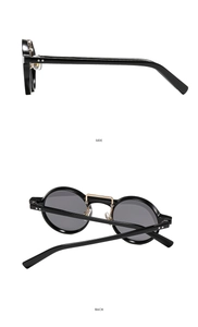 Detailed side and back view of round retro sunglasses with black frames and gold bridge