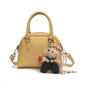 Korean style minimalist lychee pattern dome handbag with cute plush bear pendant for women.